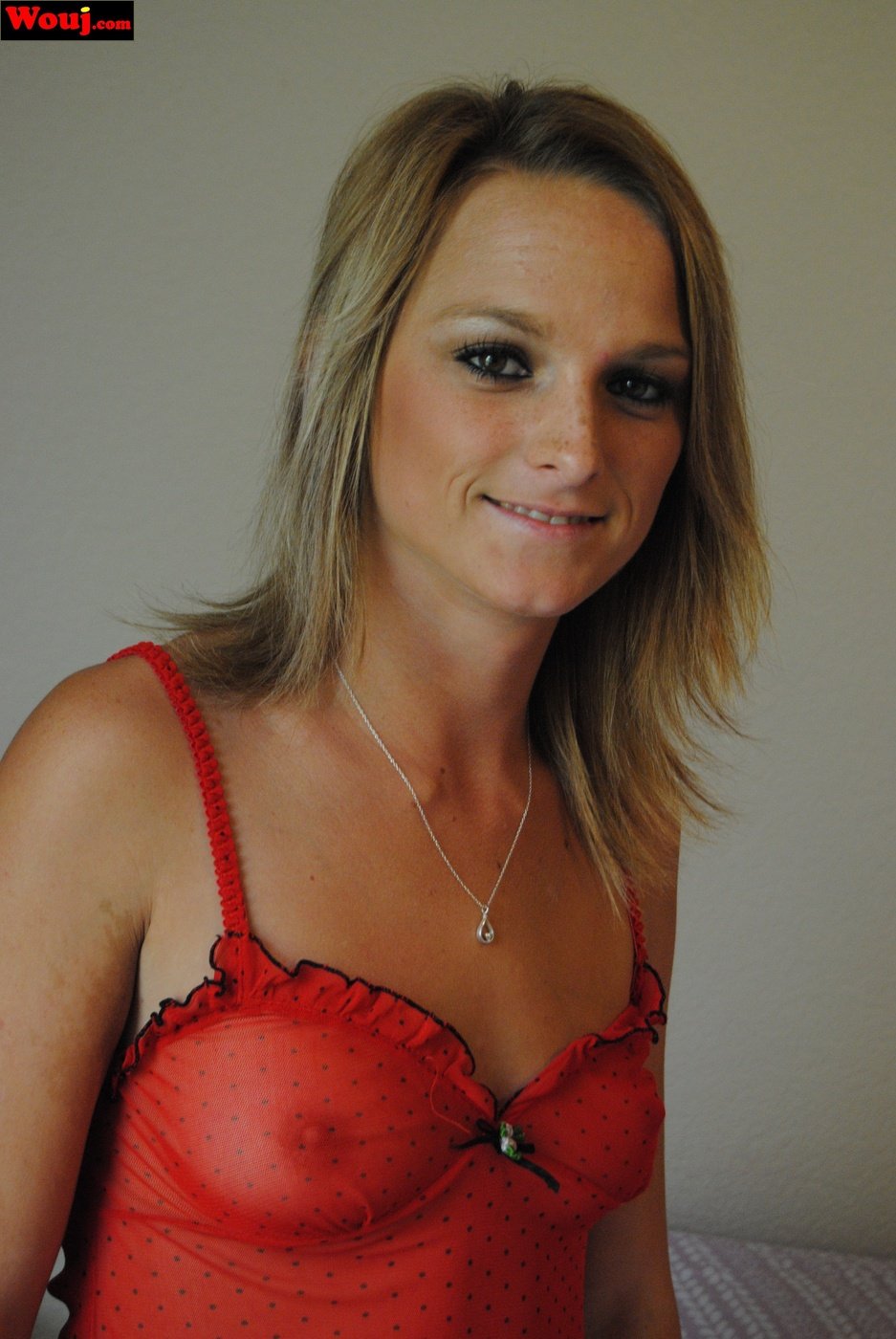 Beautiful Blonde Chick Showing Off Her Body In A Red See Through Outfit Photos