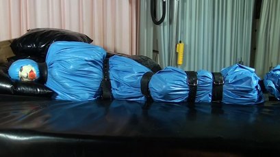 Submissive girl gets wrapped in a blue latex — 9