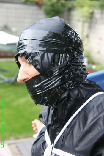 Chick being bound tightly hooded and gagged in her shiny nylon rainwear - SNA-Rainbound-Nylon (11)
