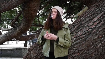 Beautiful brunette smoking a cigarette — 10