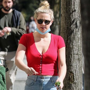 Lili Reinhart showing big cleavage in a red top