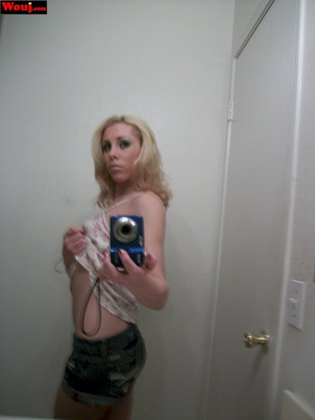 Cute blonde chick teasing with her nice tits and a bra - 000013