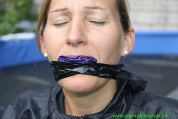 Chick being bound tightly hooded and gagged in her shiny nylon rainwear - SNA-Rainbound-Nylon (6)