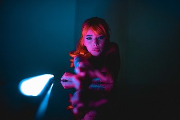 Redhead chick with tattoos puts her naked body on display - 000004