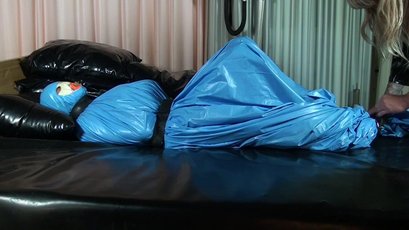 Submissive girl gets wrapped in a blue latex — 3