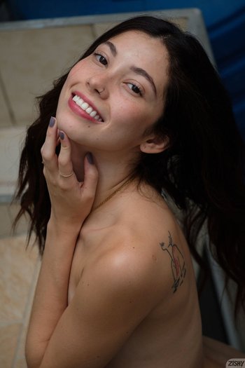 Brunette Julia Campos doing striptease and showing her boobs 008