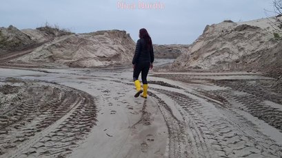 Red haired MILF walks in mud wearing rubber boots — 8