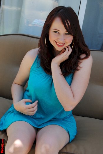 Redhead beauty teasing with her big boobs while posing - 000009