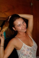 Brunette Renee Wilson having fun doing striptease and showing her tits — 1