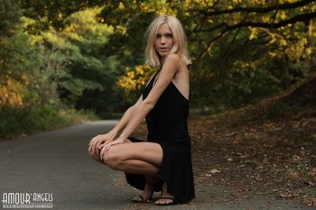 Beautiful young blond Nora Pace shamelessly strips and spreads in nature - 0011-05