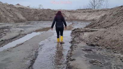 Red haired MILF walks in mud wearing rubber boots — 12