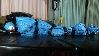 Submissive girl gets wrapped in a blue latex — 12