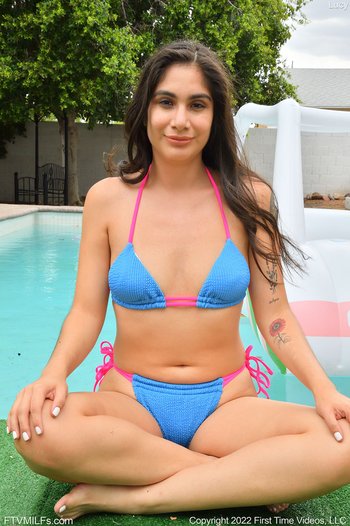 Hot Lucy Sunflower drilling her hairy pussy with a toy by the pool - 02002
