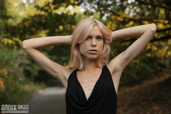 Beautiful young blond Nora Pace shamelessly strips and spreads in nature - 0011-03