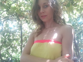 Sweet babe Naughty Adeline showing her nice boobies outdoors