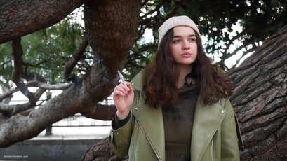 Beautiful brunette smoking a cigarette — 3