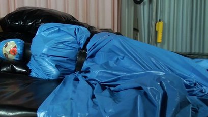 Submissive girl gets wrapped in a blue latex — 1