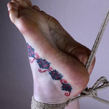 Beautiful babe with tattooed feet gets hogtied