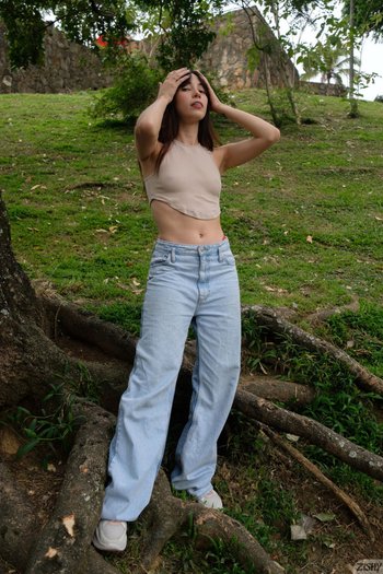 Solo Julia Campos having fun fingering her shaved twat in a park 004