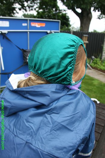 Babe enjoying bondage in her old-school rain-suit and panties on the head - SNA-Rainbound-Nylon  (8)