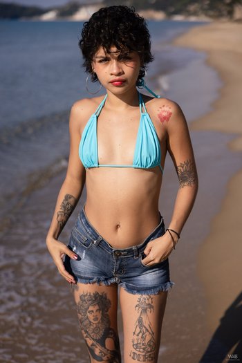 Good looking Lilith Baph with natural tits & hot as posing naked on a beach