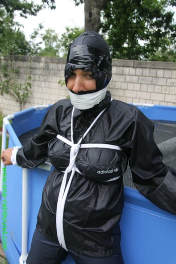 Chick being bound tightly hooded and gagged in her shiny nylon rainwear - SNA-Rainbound-Nylon (15)
