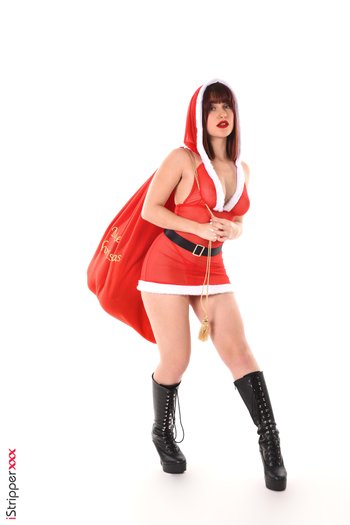 Carla Vyxx dresses as Ms. Claus playing with her favorite red dildo - VGI1582P02017
