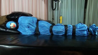 Submissive girl gets wrapped in a blue latex — 10