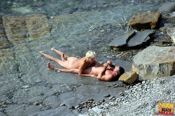 Naked Milf playing with her Man on the Beach