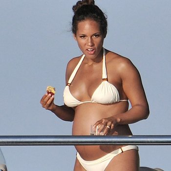 Alicia Keys in white bikini on a boat