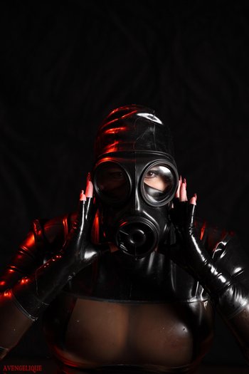 Thick whore poses wearing latex costume and mask - Rubber-Tits-Latex%20%20(4)