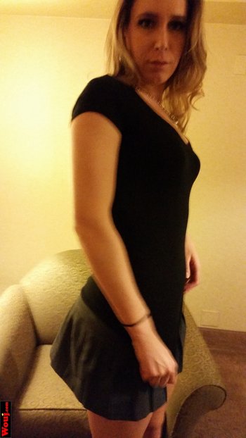 Hot blonde amateur in black dress poses seductively for the camera