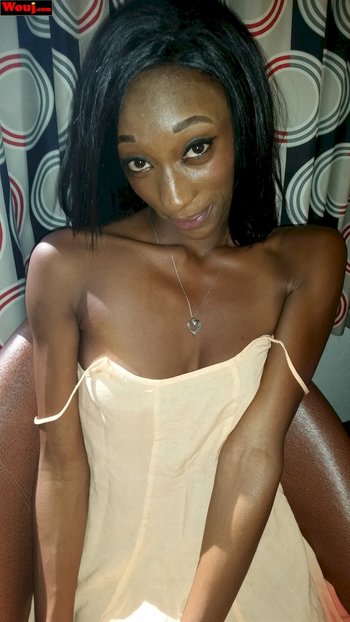 Hot ebony girl tries out different outfits in the bedroom - 000011
