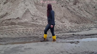 Red haired MILF walks in mud wearing rubber boots — 11