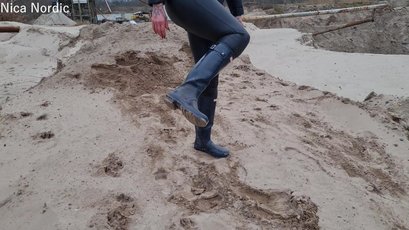 Red haired MILF walks in mud wearing rubber boots — 6