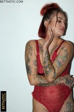 Redhead amateur shows off her tattoos in red lingerie — 13