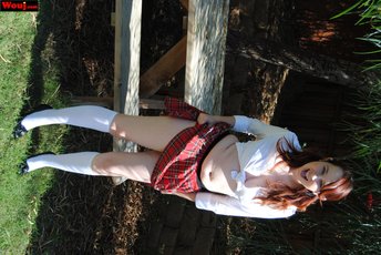 Sexy schoolgirl showing her white panties outdoors — 5