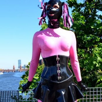 Rubber Doll in the Sun posing in tight Latex