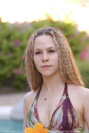 Blonde Fiona Luv with hot ass posing naked outdoors by the pool 001