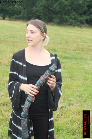 Cute clothed babe plays with a tentacle outdoors - 000005.jpg