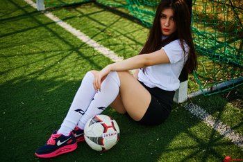 Hot brunette girl Anastasia Lipov posing on the soccer field - 000004