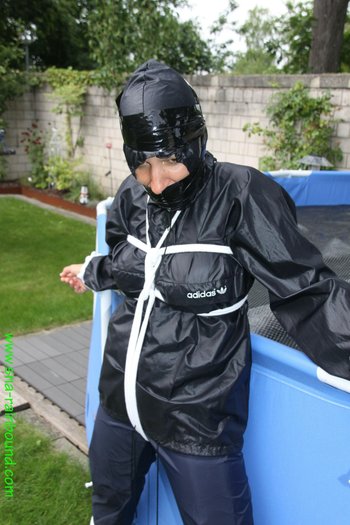 Chick being bound tightly hooded and gagged in her shiny nylon rainwear - SNA-Rainbound-Nylon (12)