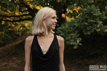 Beautiful young blond Nora Pace shamelessly strips and spreads in nature - 0011-02