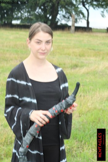 Cute clothed babe plays with a tentacle outdoors - 000009.jpg