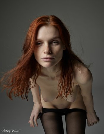 Redhead model Vi Kolodko in black stockings fooling around - 0001-02_1200