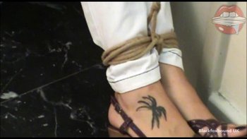 Submissive brunette with a duct tape on her lips is tied to the door - Submissive brunette with a duct tape on her lips is tied to the door 008