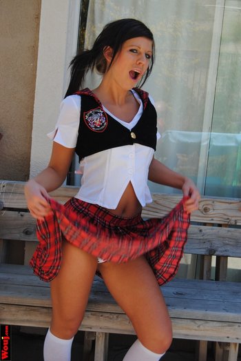 Gorgeous schoolgirl showing her panties while posing - 000007
