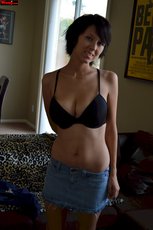 Brunette cutie takes off her shirt and shows her big tits in a bra — 15