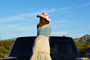 Smoking hot Emily Rain showing her sexy curves on a truck outdoors - 000001